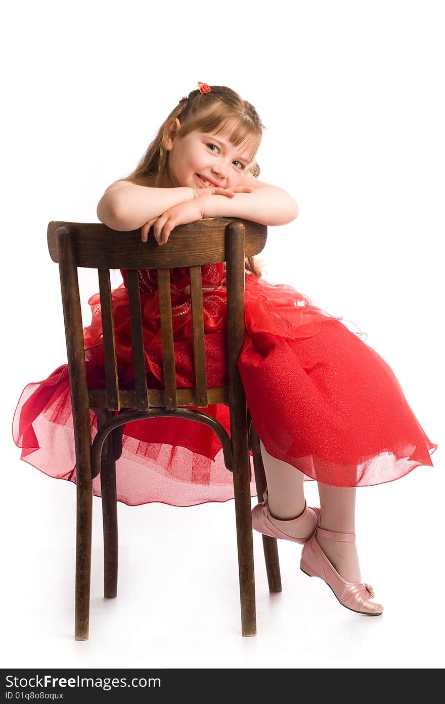 An image of nice girl on brown chair. An image of nice girl on brown chair