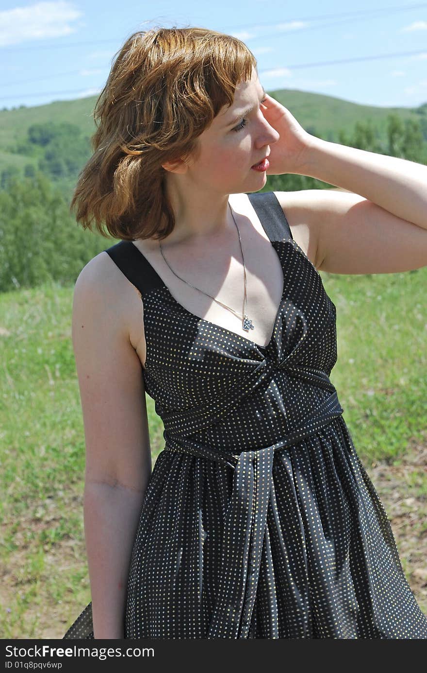 Young woman on verdure background