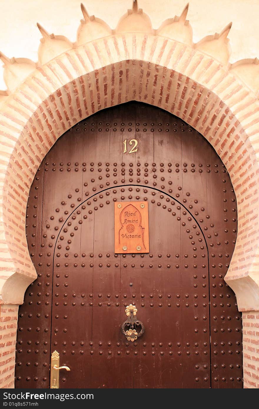 Arch and door in street in Marrakech