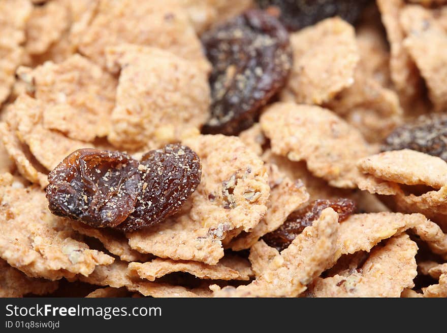 A macro shot of a cereal with raisins.