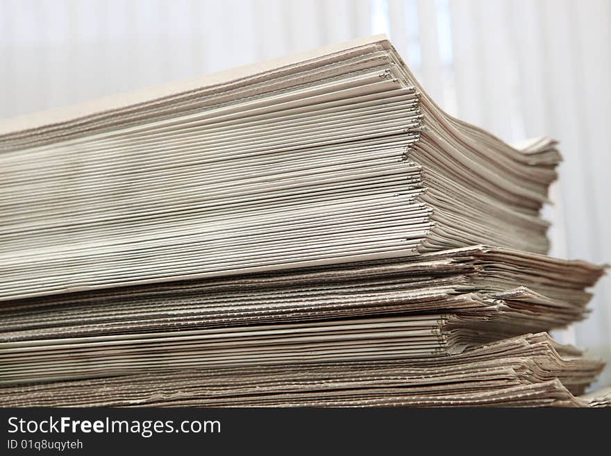 Greater pack of newspapers on a table. Greater pack of newspapers on a table