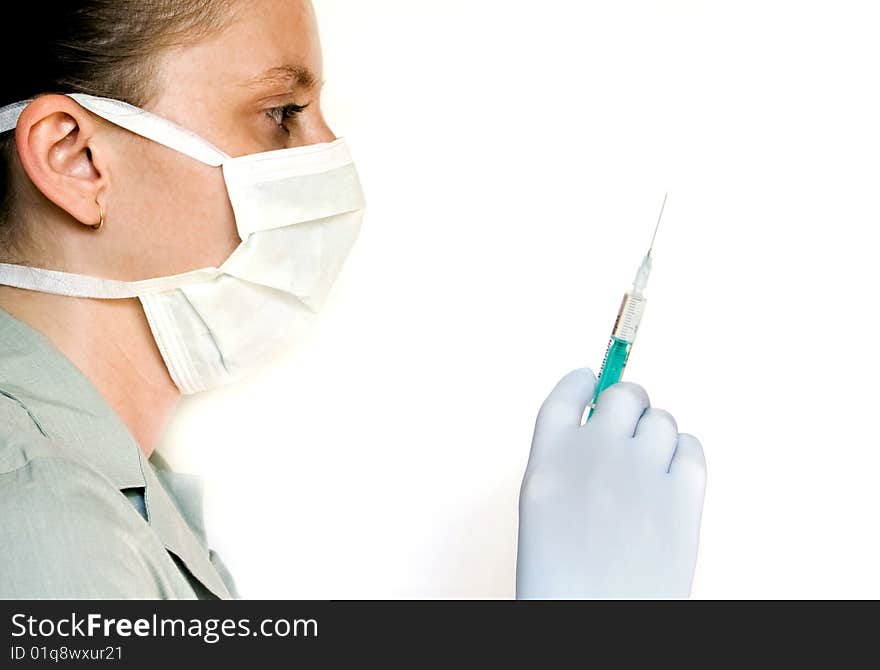 Female doctor with syringe in hand