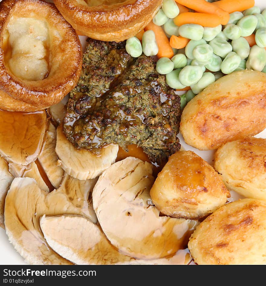 Roast pork dinner with gravy and Yorkshire pudding