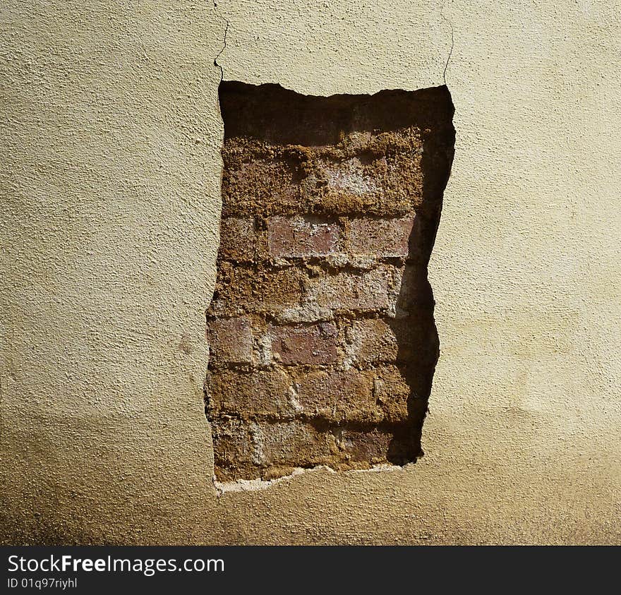 A wall with unusual damage applied to it. A wall with unusual damage applied to it.