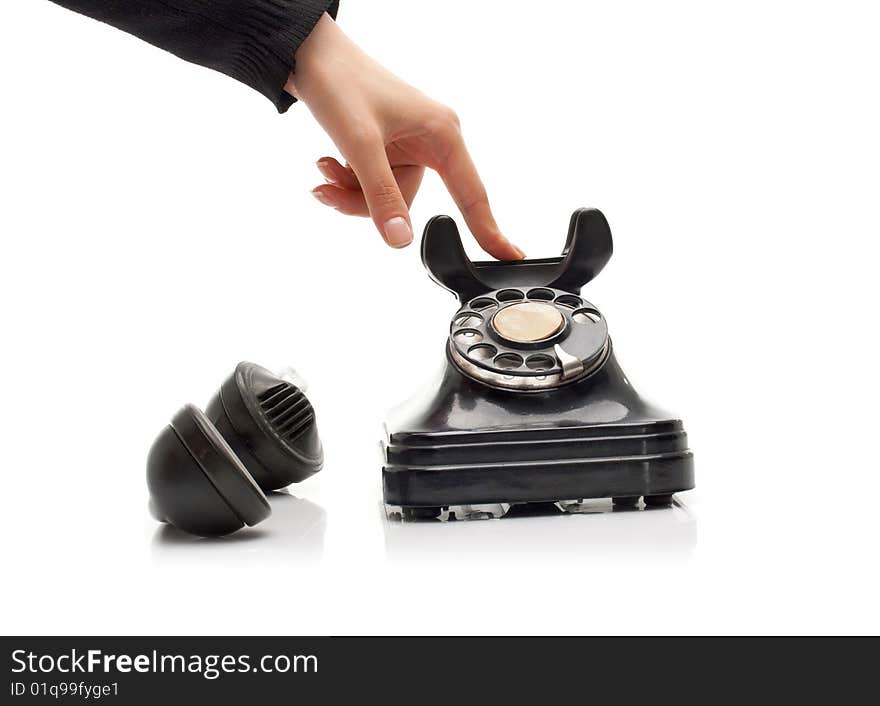 Ending communication on a vintage black telephone. Ending communication on a vintage black telephone