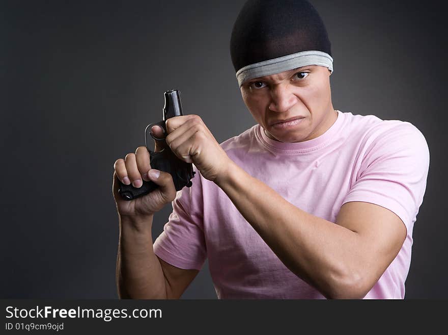 The aggressive young man shows gesture by a hand