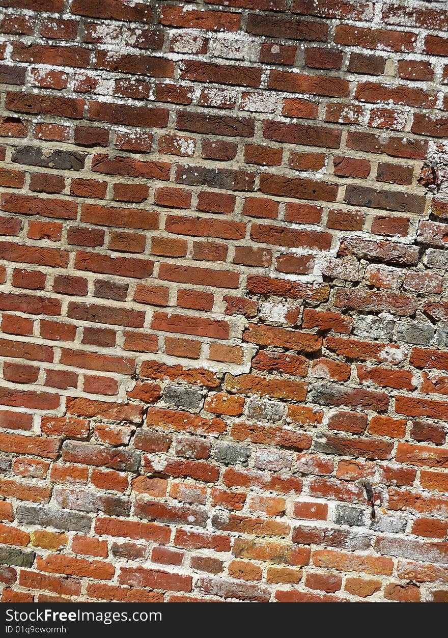 An old worn brick wall. An old worn brick wall.