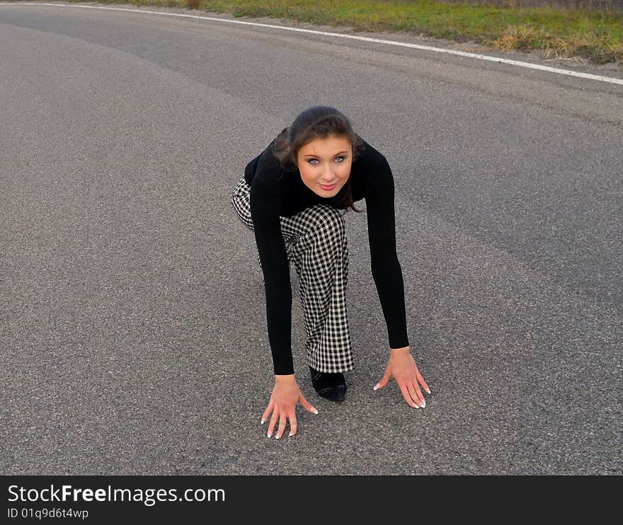 Young nice woman on road  sunny day, spring