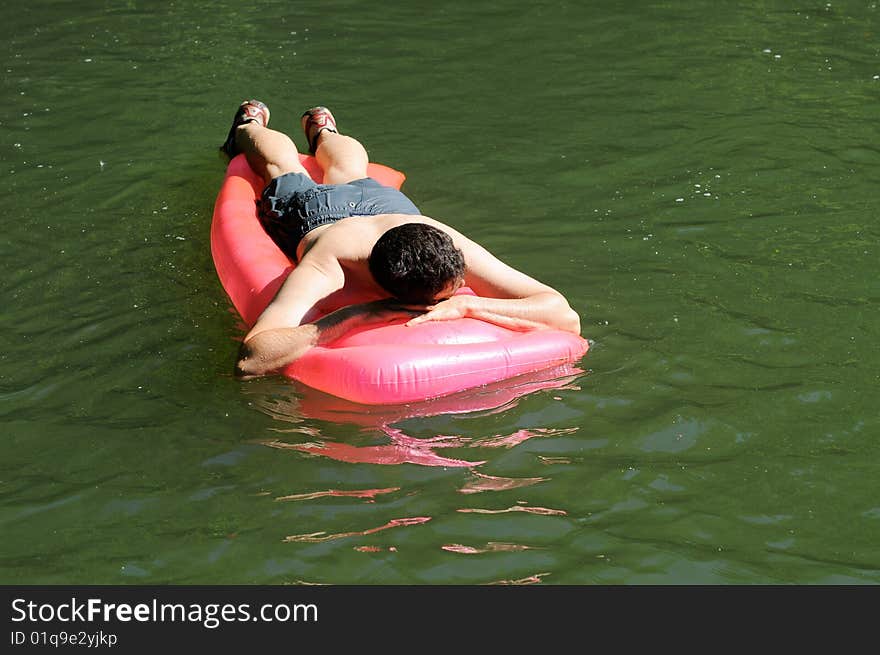 Portrait of man floating on river. Portrait of man floating on river