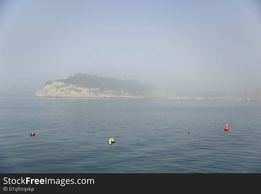 Morning fog on the sea. A foggy morning in Makarska, Croatia. Morning fog on the sea. A foggy morning in Makarska, Croatia.