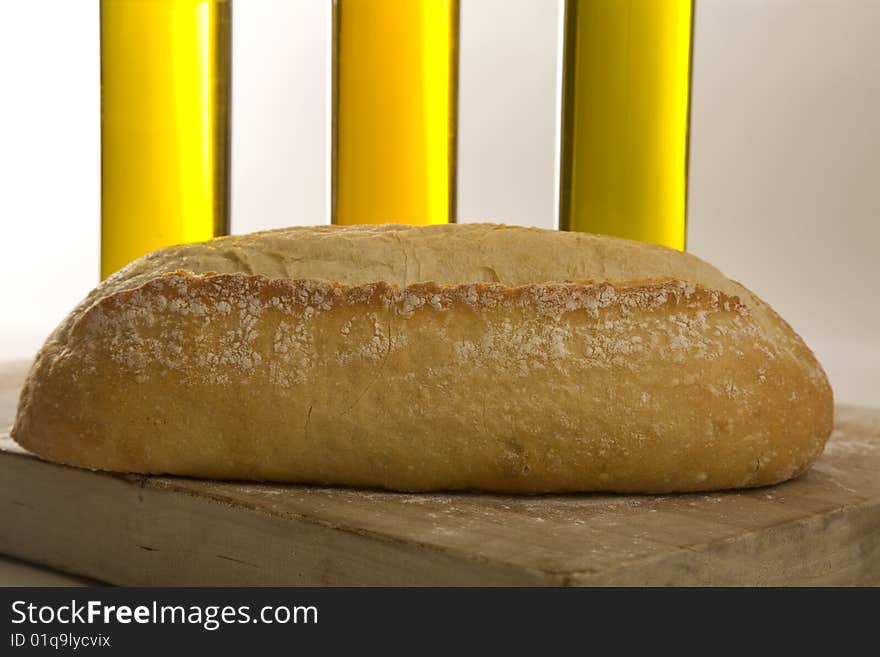 Italian artisan bread on cutting board with eggs and wine. Italian artisan bread on cutting board with eggs and wine.