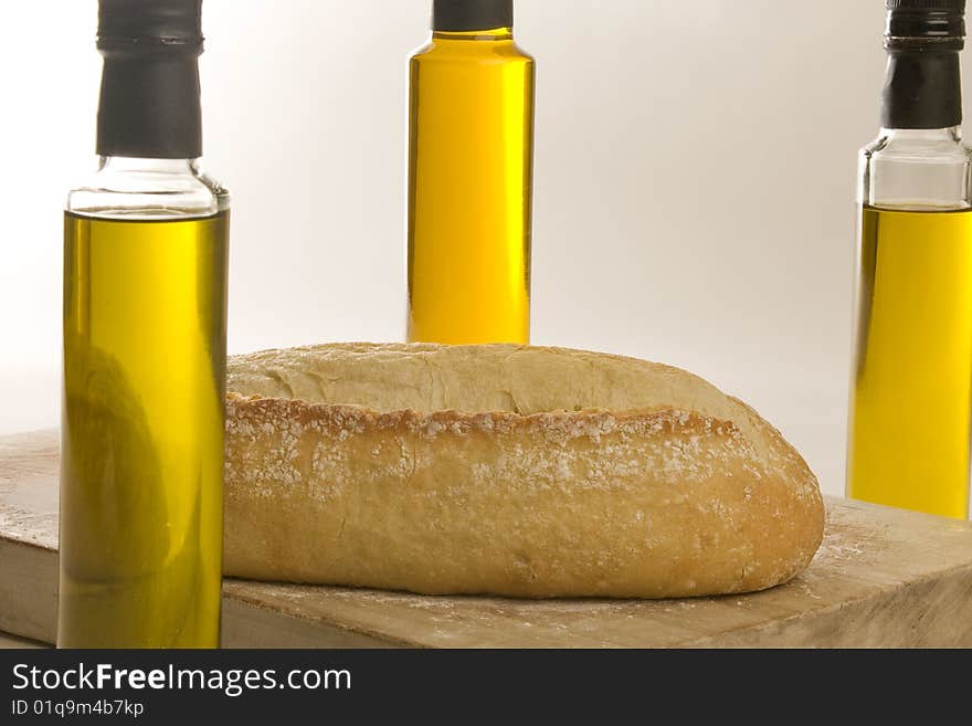 Italian artisan bread on cutting board with eggs and wine. Italian artisan bread on cutting board with eggs and wine.