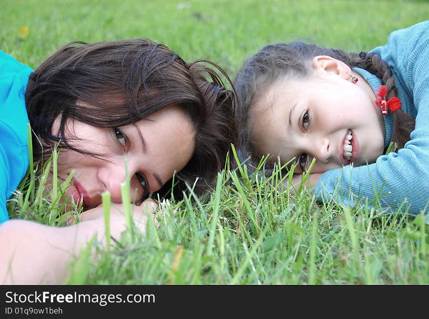 Mother resting outdoor with daughter