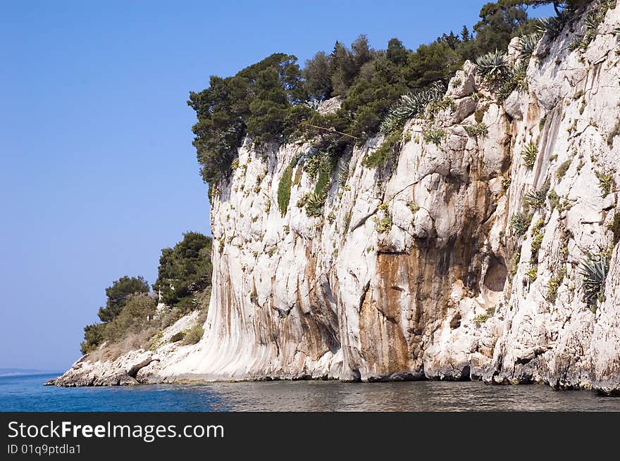 Clif and forest on the Adriatic coast, Makarska, Dalmatia, Croatia. Clif and forest on the Adriatic coast, Makarska, Dalmatia, Croatia.