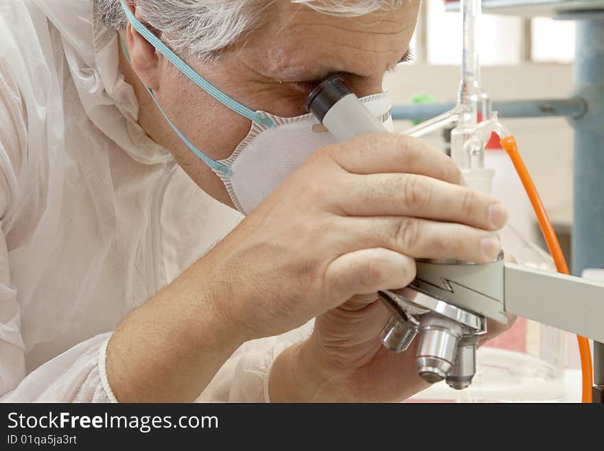 A researcher at work in his laboratory. A researcher at work in his laboratory