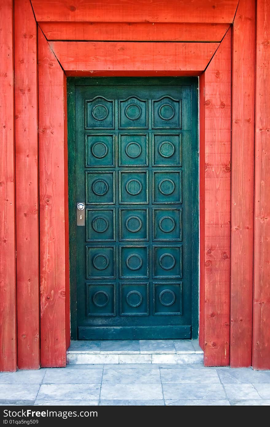 Wooden turquoise door with red doorjamb. Wooden turquoise door with red doorjamb.