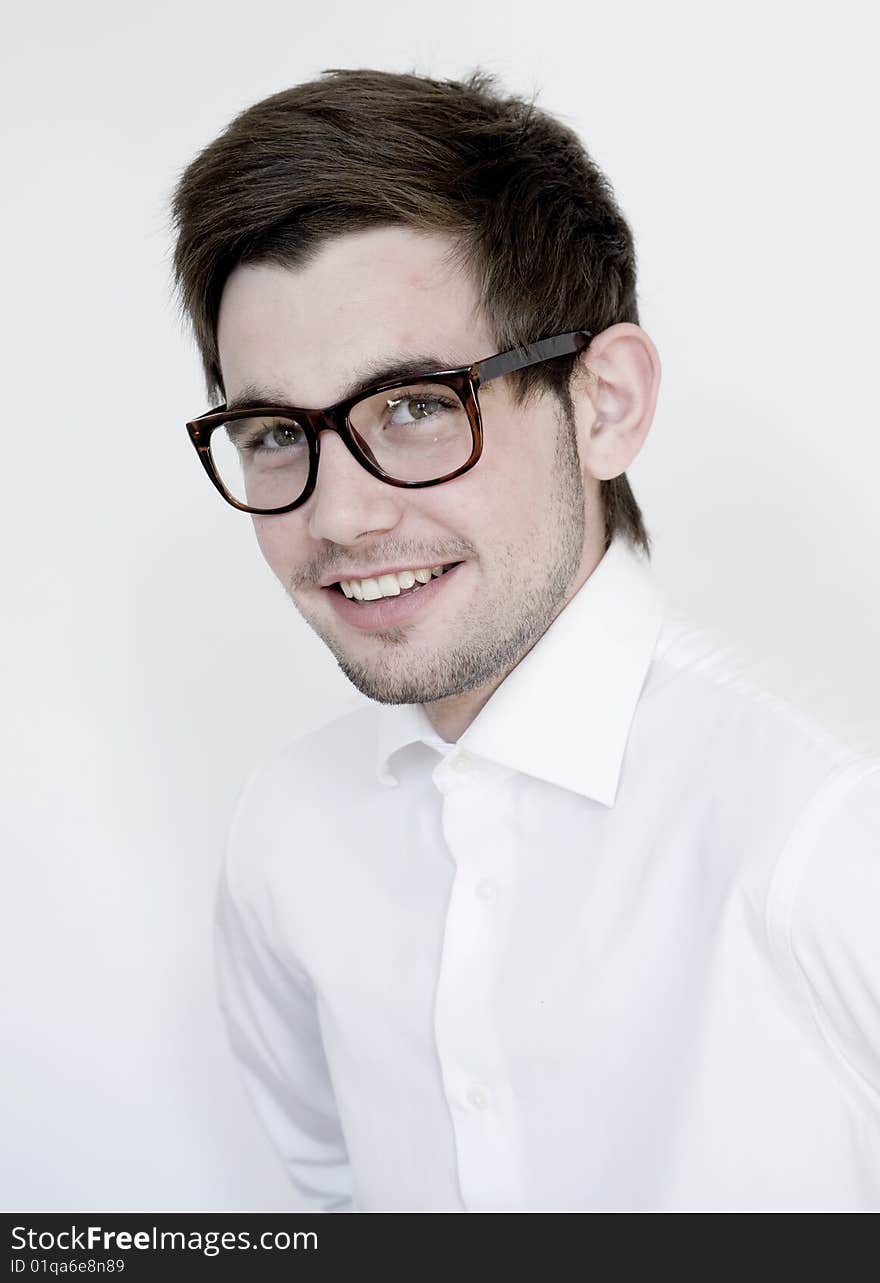 Young stylish man wears glasses and white shirt. Young stylish man wears glasses and white shirt