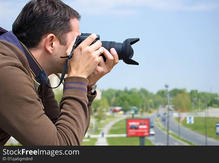 Male photographer waiting for a nice shoot.