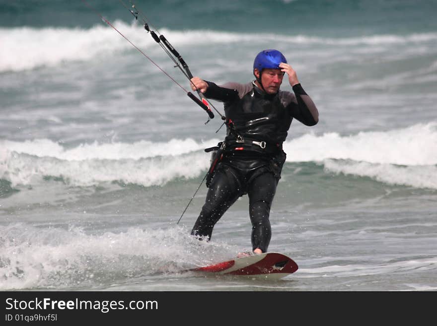 Kitesurfer surfing on the waves