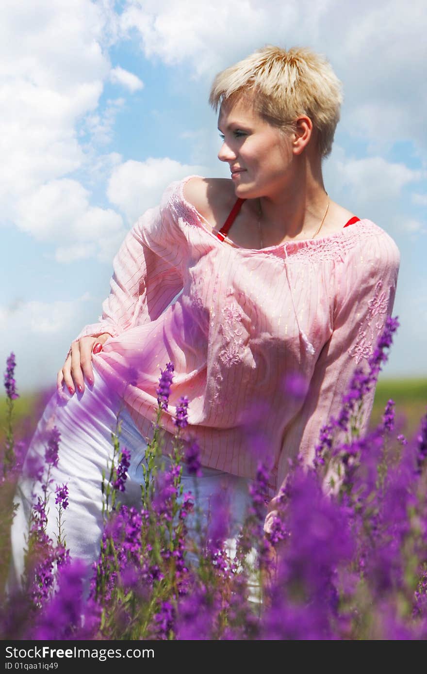 Attractive young woman on natural background