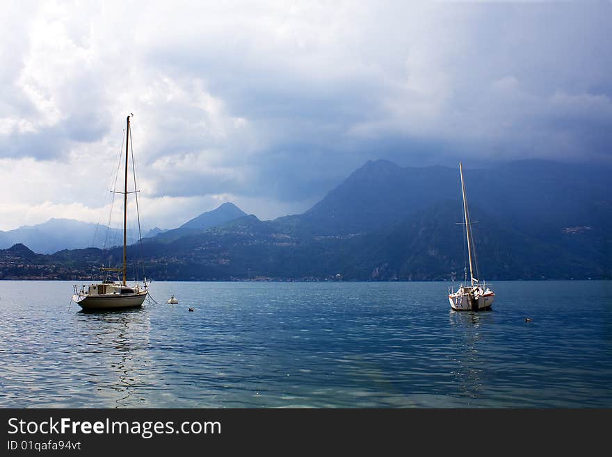 Boats on the lake with stormy sky