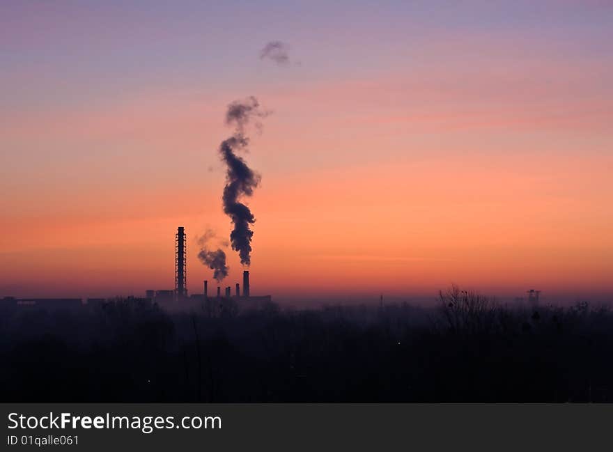 Factory silhouette in sunrise