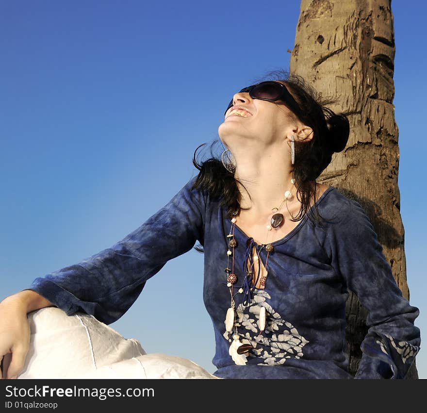 Portrait of young trendy female model enjoying the summer