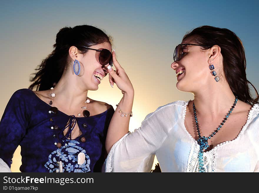 Portrait of two trendy young women having fun. Portrait of two trendy young women having fun