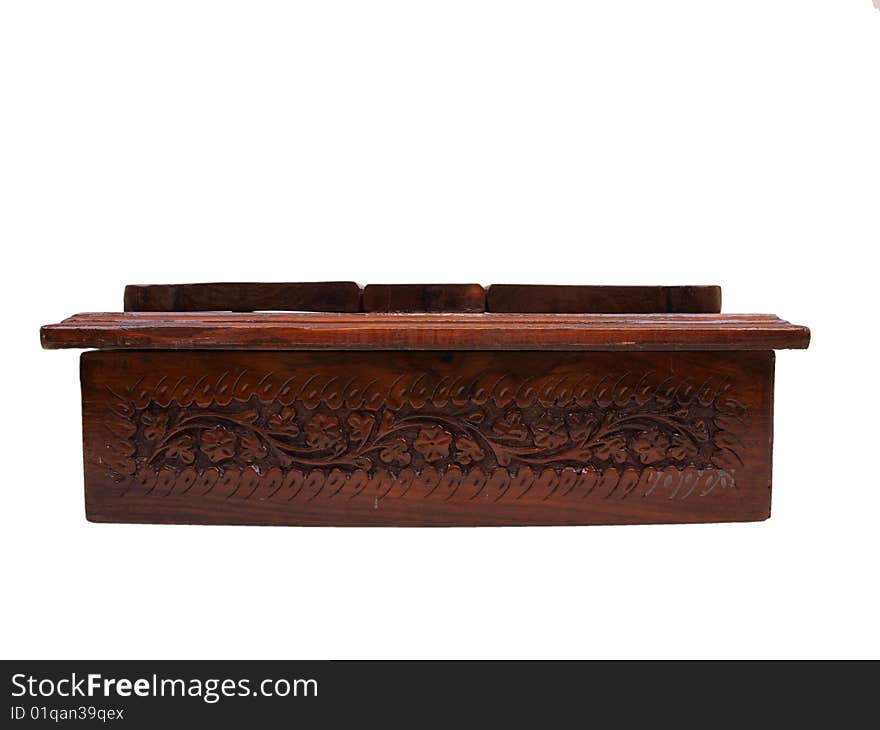 Front view of decorative floral pattern brown colored wooden chest box for storing items like books, jewelry, & other small items. Front view of decorative floral pattern brown colored wooden chest box for storing items like books, jewelry, & other small items.