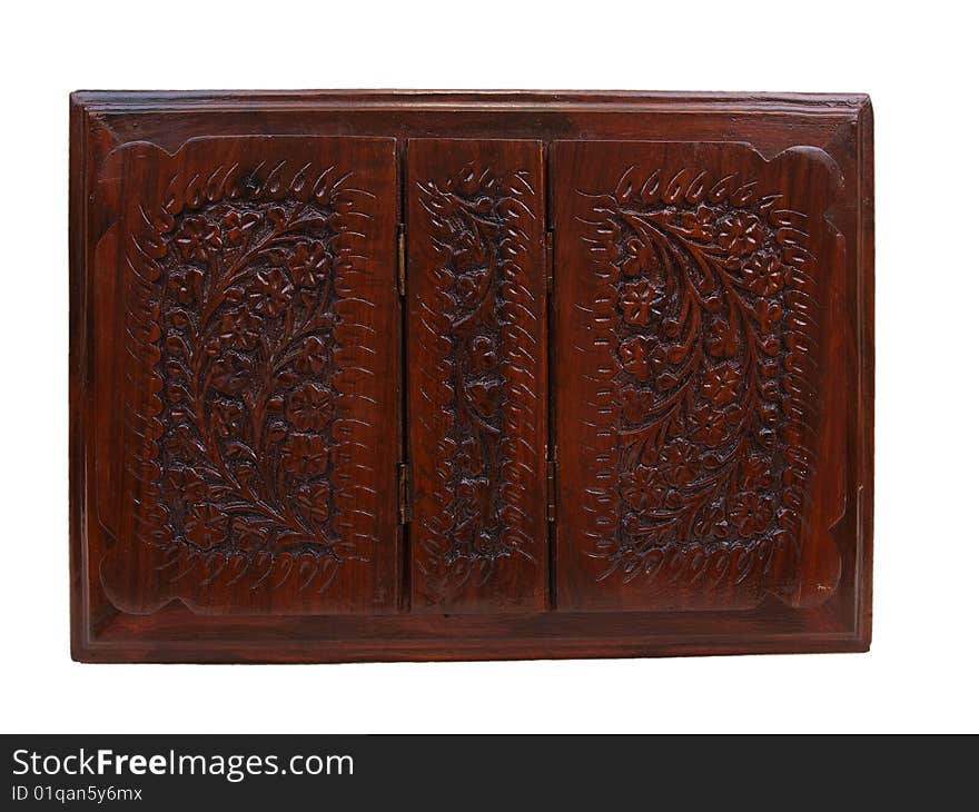 Top view of decorative floral pattern brown colored wooden chest box for storing items like books, jewelry, & other small items. Top view of decorative floral pattern brown colored wooden chest box for storing items like books, jewelry, & other small items.