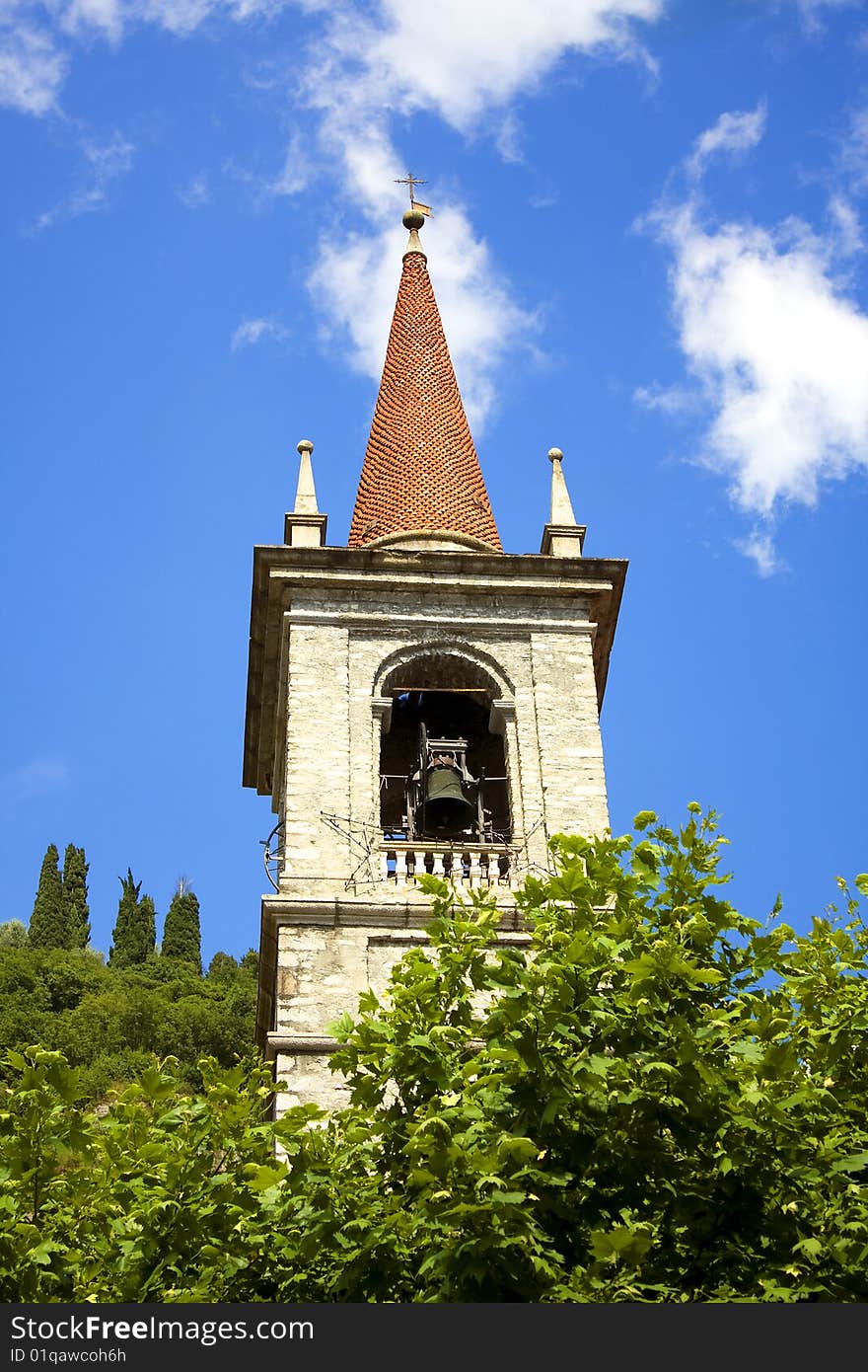 Tower among the trees and sky blue