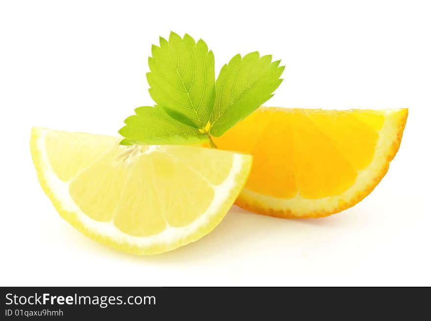 Lobule of lemon and orange with leaves. Lobule of lemon and orange with leaves