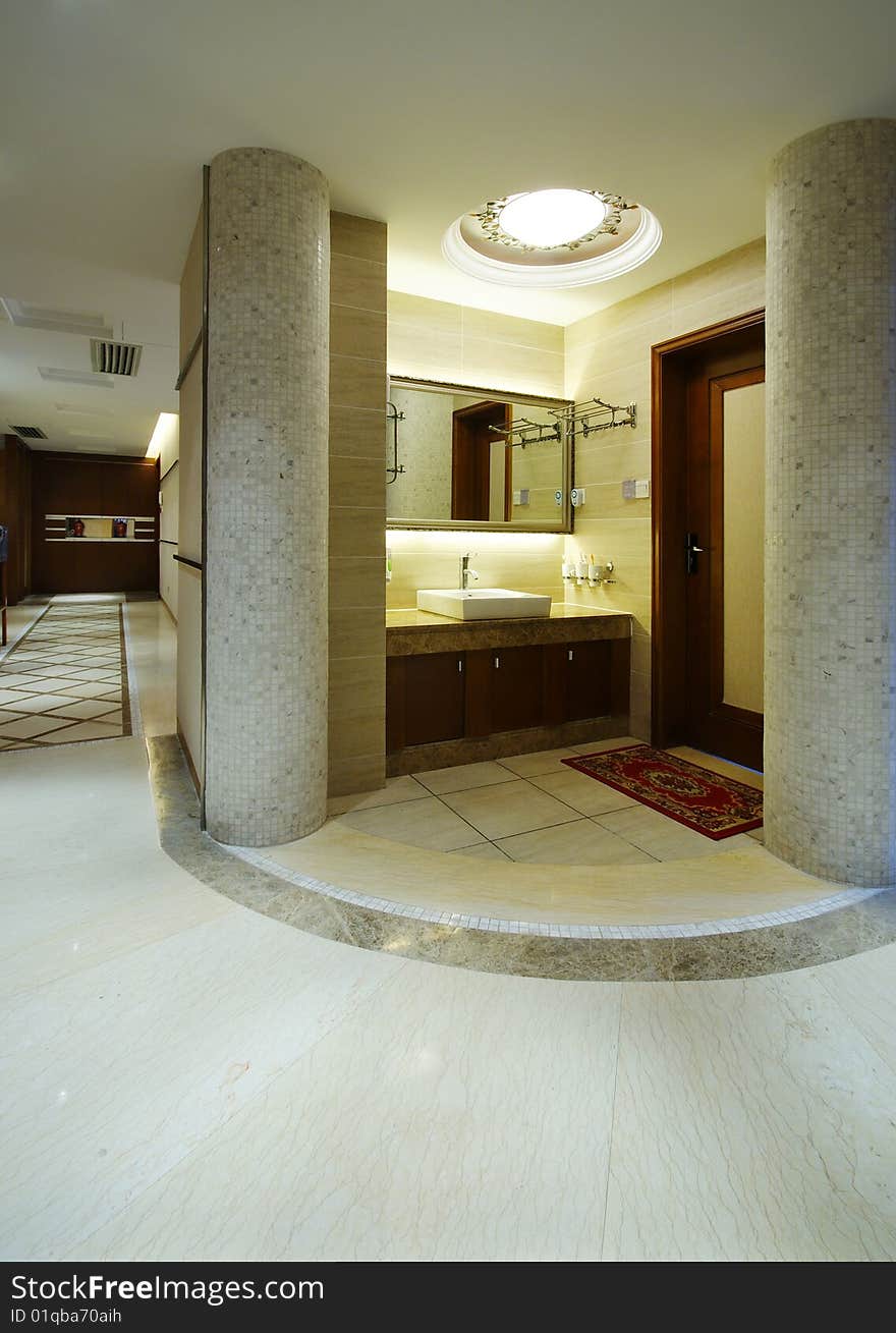 Modern home or apartment area with sink and marble pillars. Modern home or apartment area with sink and marble pillars.