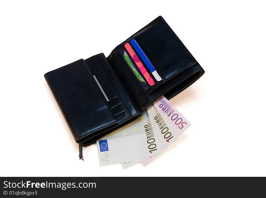 Black leather purse with money and credit cards on a white background