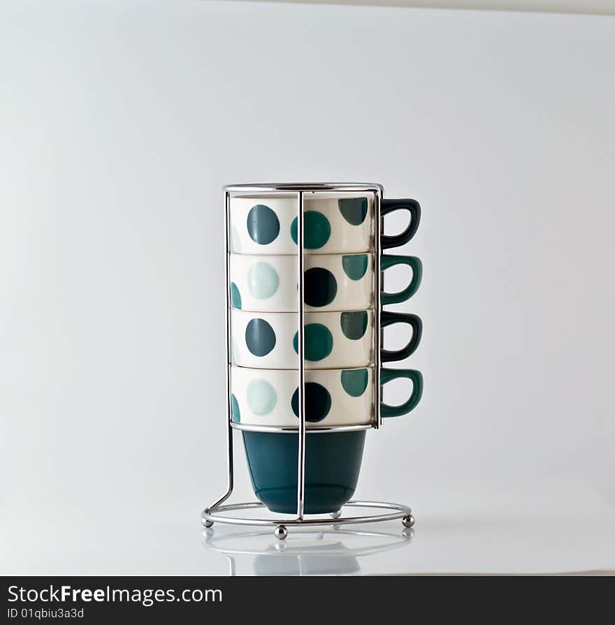 Four Mugs on a steel vertical stand. Four Mugs on a steel vertical stand