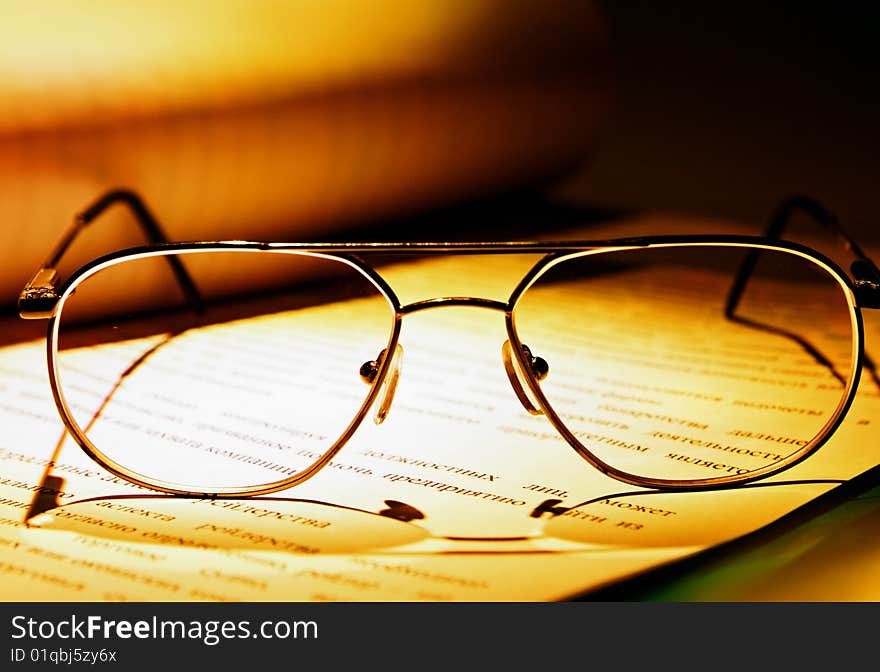 Eyeglasses on the book close-up. Eyeglasses on the book close-up