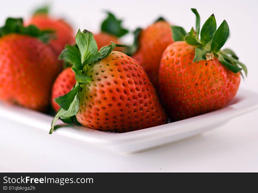 Strawberries on a white plate. Strawberries on a white plate