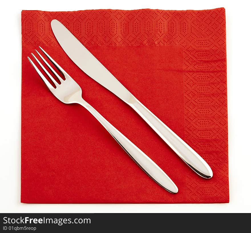 Fork and knife on a red napkin