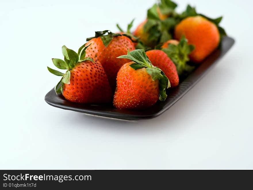 Strawberries in a black plate. Strawberries in a black plate