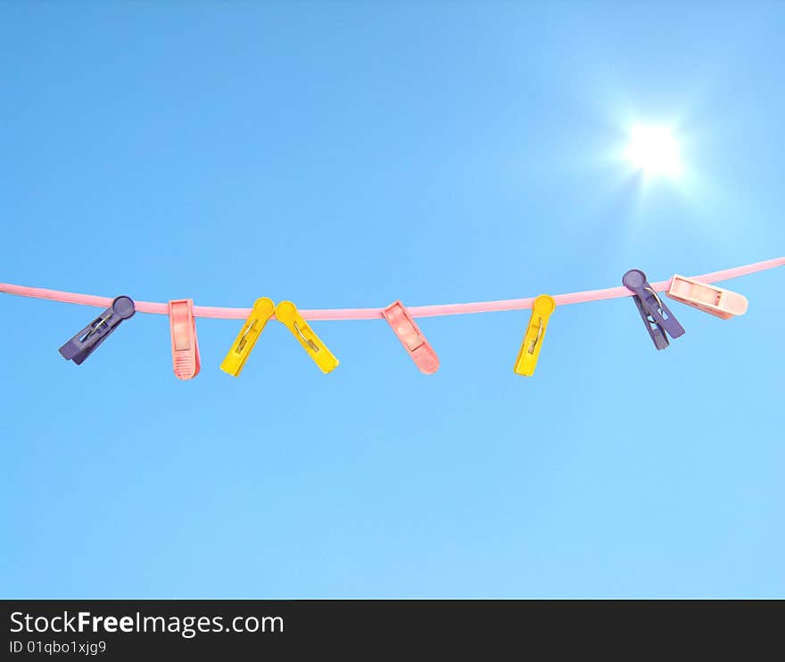 Clothes peg on sky background