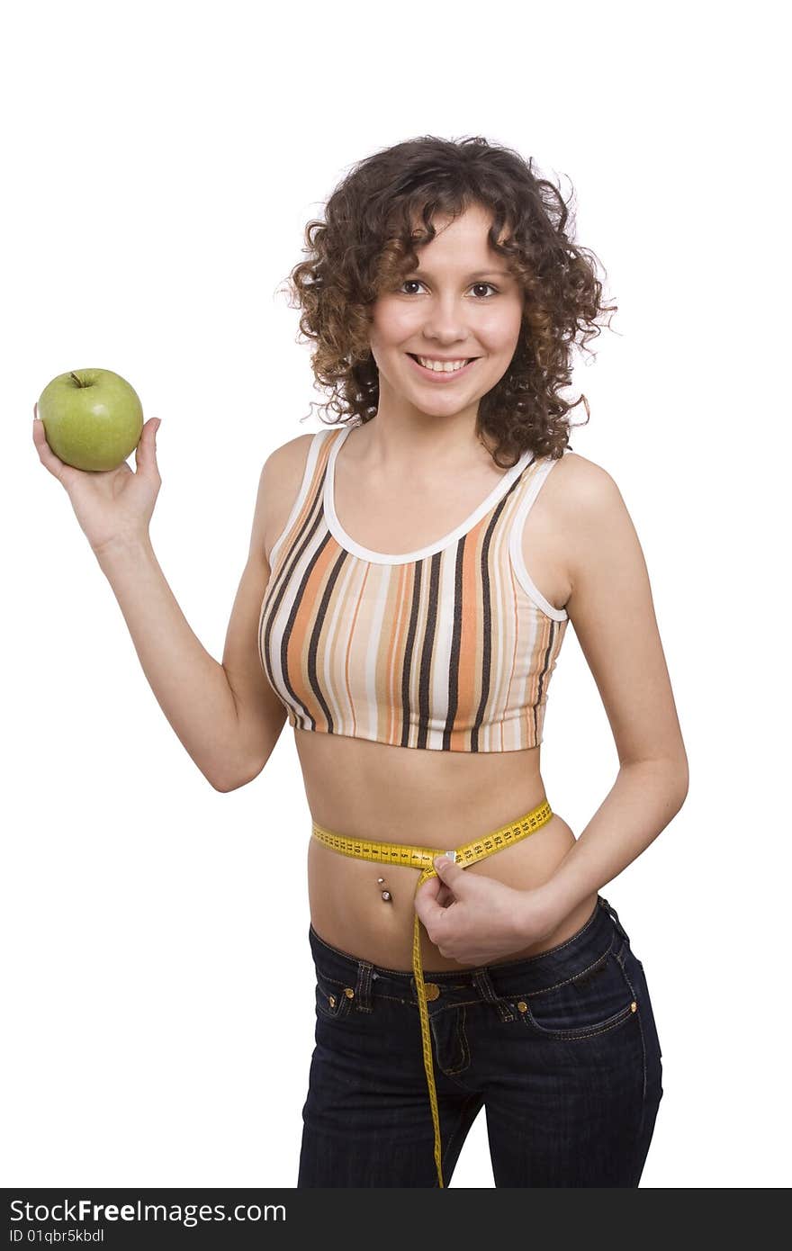 Beautiful fit woman with measure tape isolated over white. Weight loss and healthy lifestyle concept. Girl measuring waist with a tape measure. Isolated. Woman hold apple in hand. Beautiful fit woman with measure tape isolated over white. Weight loss and healthy lifestyle concept. Girl measuring waist with a tape measure. Isolated. Woman hold apple in hand