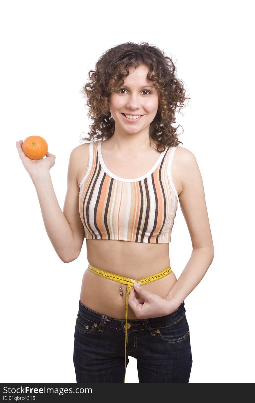 Beautiful fit woman with measure tape isolated over white. Weight loss and healthy lifestyle concept. Girl measuring waist with a tape measure. Isolated. Woman hold orange in hand. Waist is 65.5 centimeters. Beautiful fit woman with measure tape isolated over white. Weight loss and healthy lifestyle concept. Girl measuring waist with a tape measure. Isolated. Woman hold orange in hand. Waist is 65.5 centimeters.