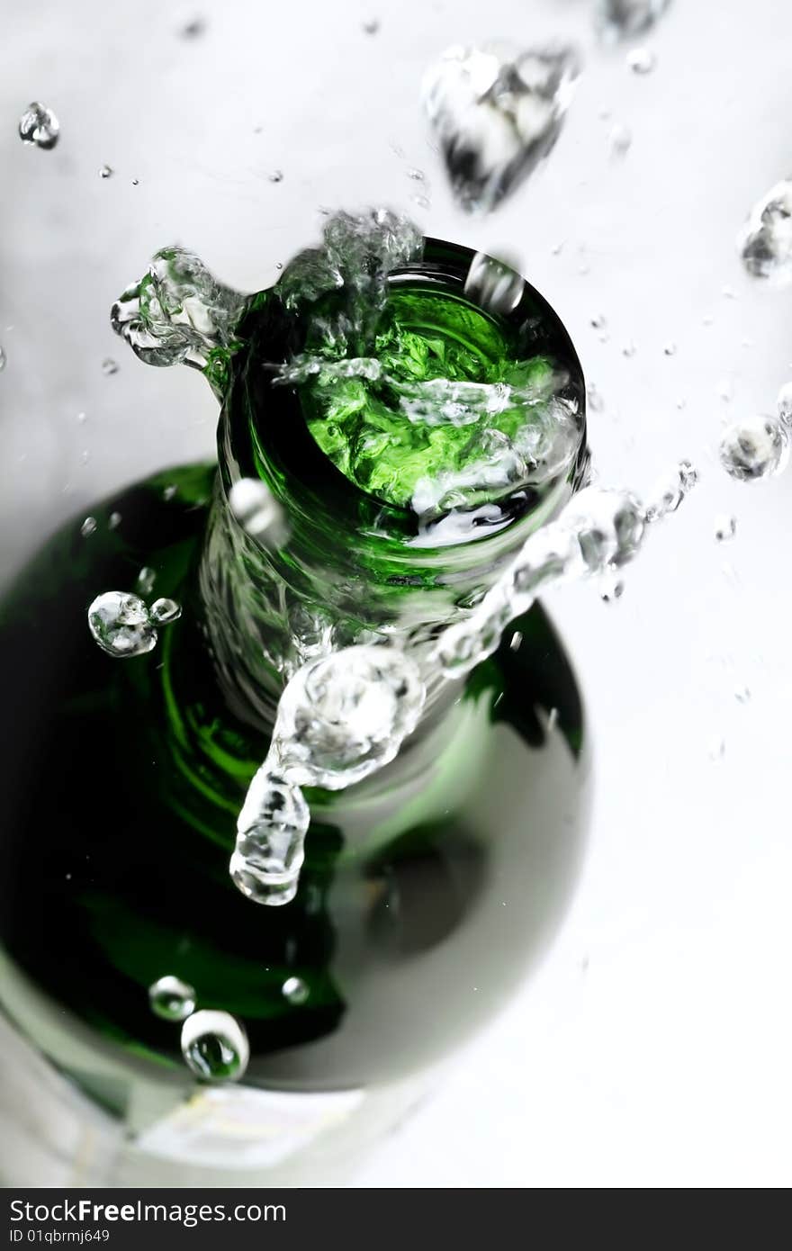 Bottle with water drops close-up