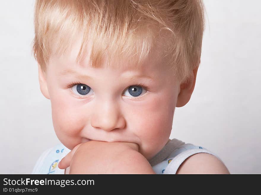 Portrait of the blond little boy on a background. Portrait of the blond little boy on a background