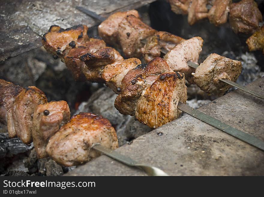 Shish kebab roasting on an open fire