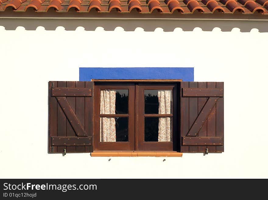 WINDOW OF REMODELED COTTAGE WITH TRADITIONAL ARCHITECTURE. WINDOW OF REMODELED COTTAGE WITH TRADITIONAL ARCHITECTURE