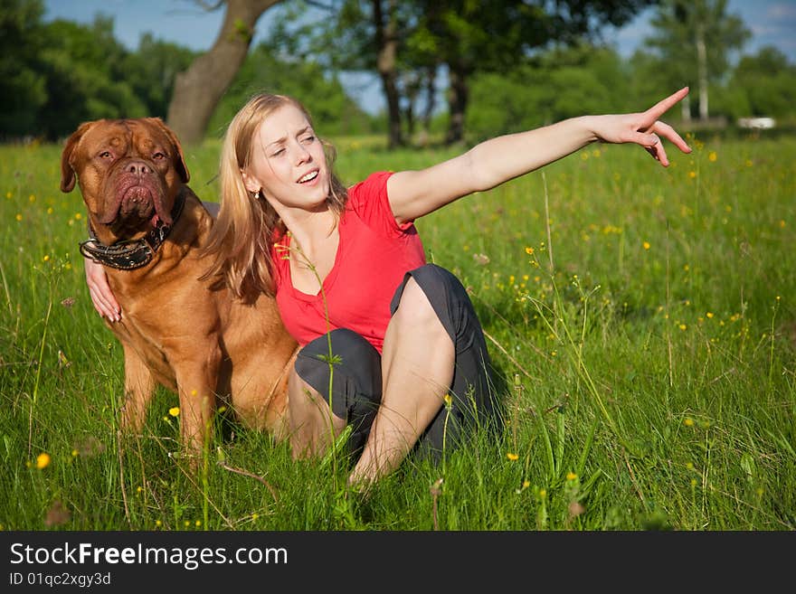 Young girl and her dog (French mastiff, Dogue de Bordeaux)