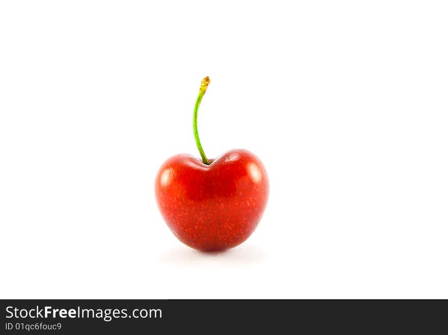 Single red cherry on a white background with clipping path