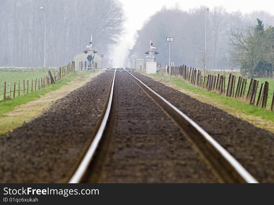 Railtrack with hazy crossing in the background. Railtrack with hazy crossing in the background.