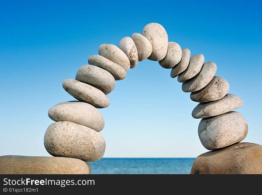 A clear line of arc of gravel on the seashore. A clear line of arc of gravel on the seashore